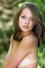 Naked teen posing in the forest-00