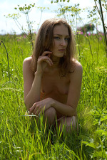 Naked model posing at the field-09