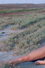 Naked blond girl undressing outdoors-13