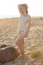 Cute Blonde Ranova Is Naked In The Sand-02