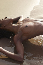 Naked ebony babe posing by the sea-14