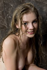 Naked teen takes a hot bath-03
