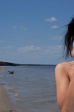 Naked girl having fun at the seashore-15