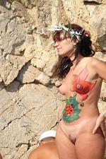 Nude beach hotties get covered with cute drawings-02