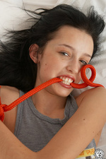 Black haired young chick with tied hands-00