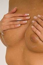 Gorgeous blonde lotions her breasts-06