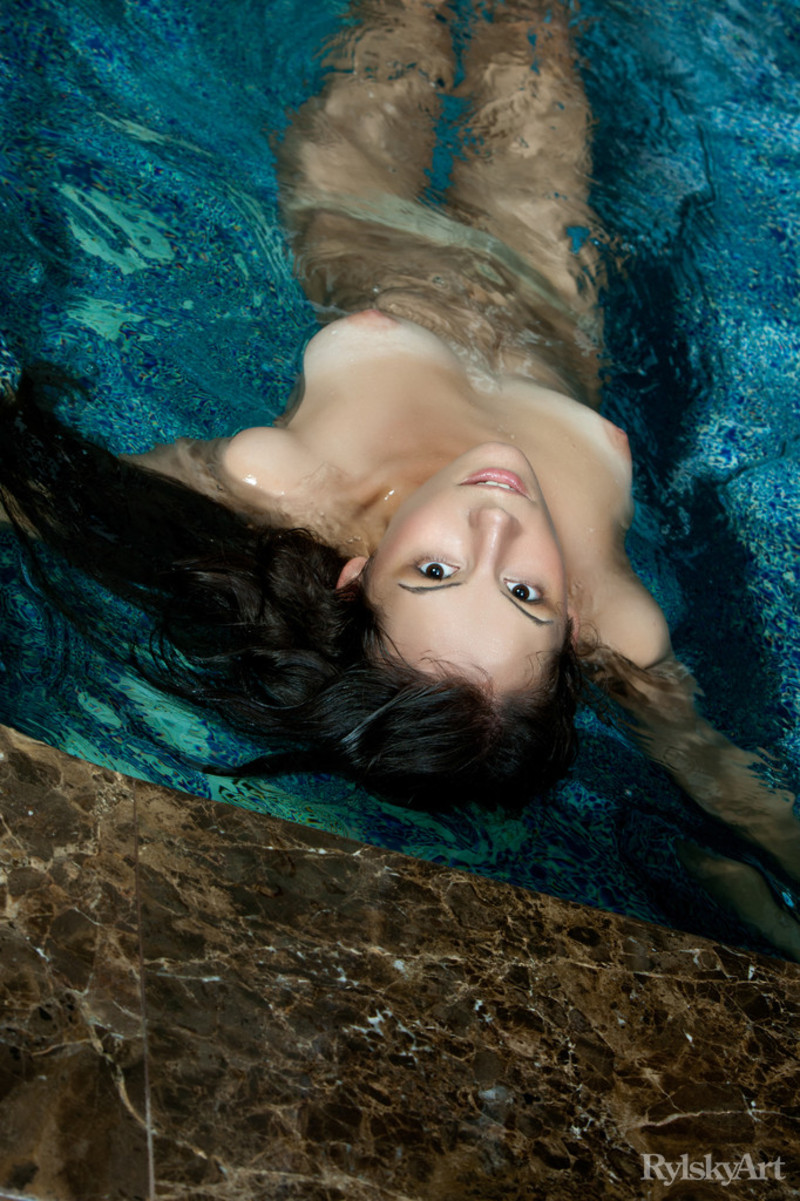 Naked teen girl having fun by the pool-03