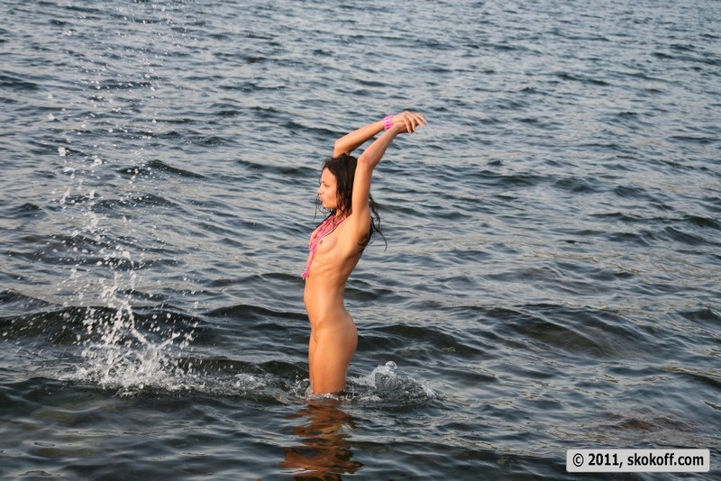 Teen cutie gets naked at the sea-12