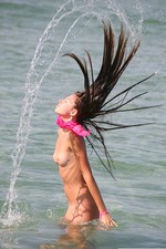 Teen girl gets naked at the beach-17