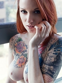 Tattooed redhead teen